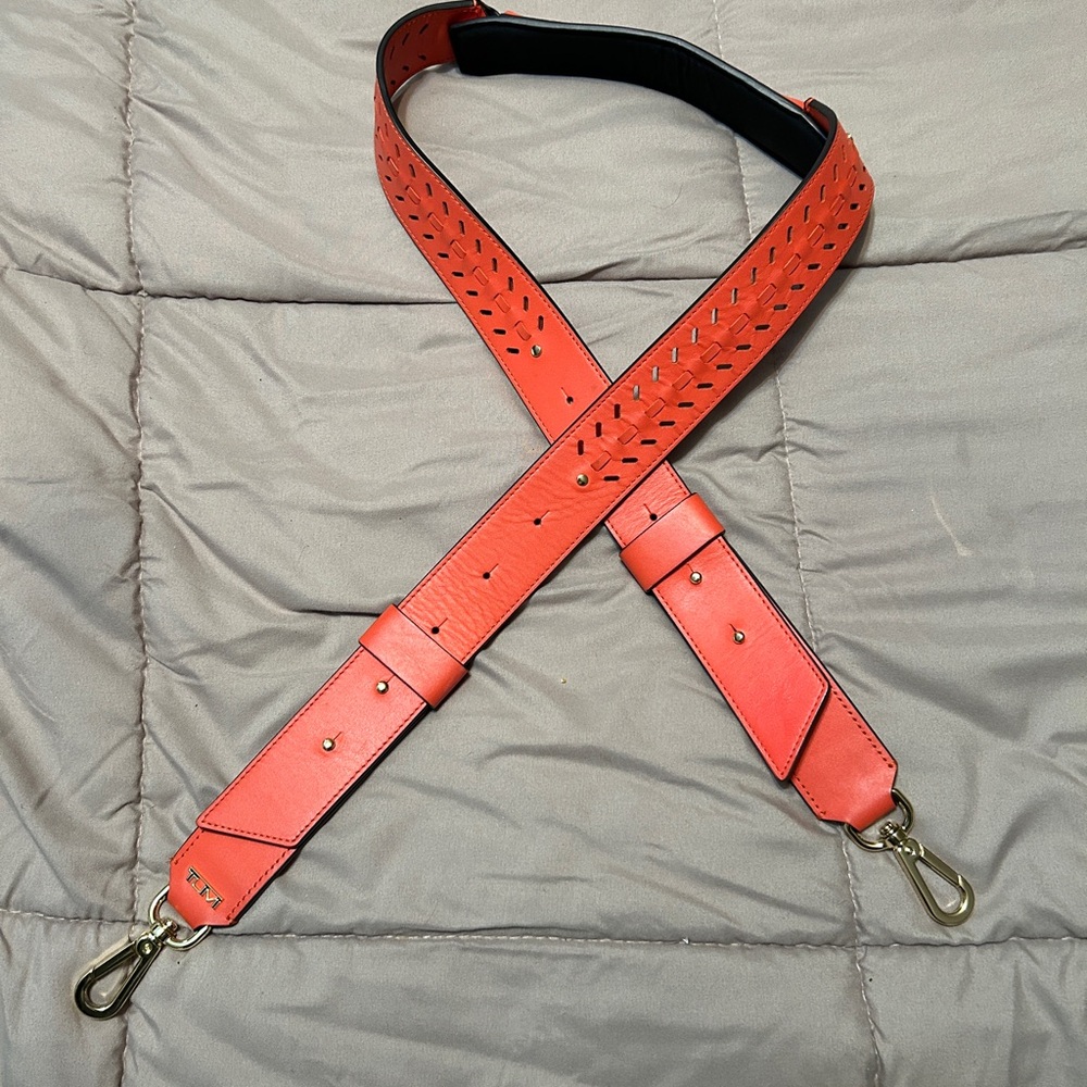 TUMI Accents Custom Adjustable Shoulder Strap in Red Orange with gold hardware.